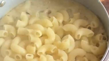 Baked caramelised onion mac and cheese topped with melted cheddar and breadcrumbs